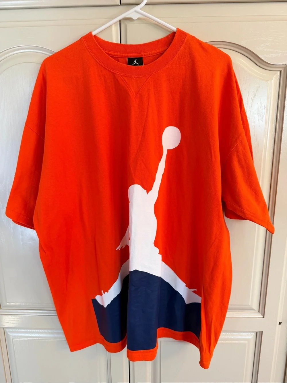 Jordan men’s Orange Graphic Tee with jumpman logo